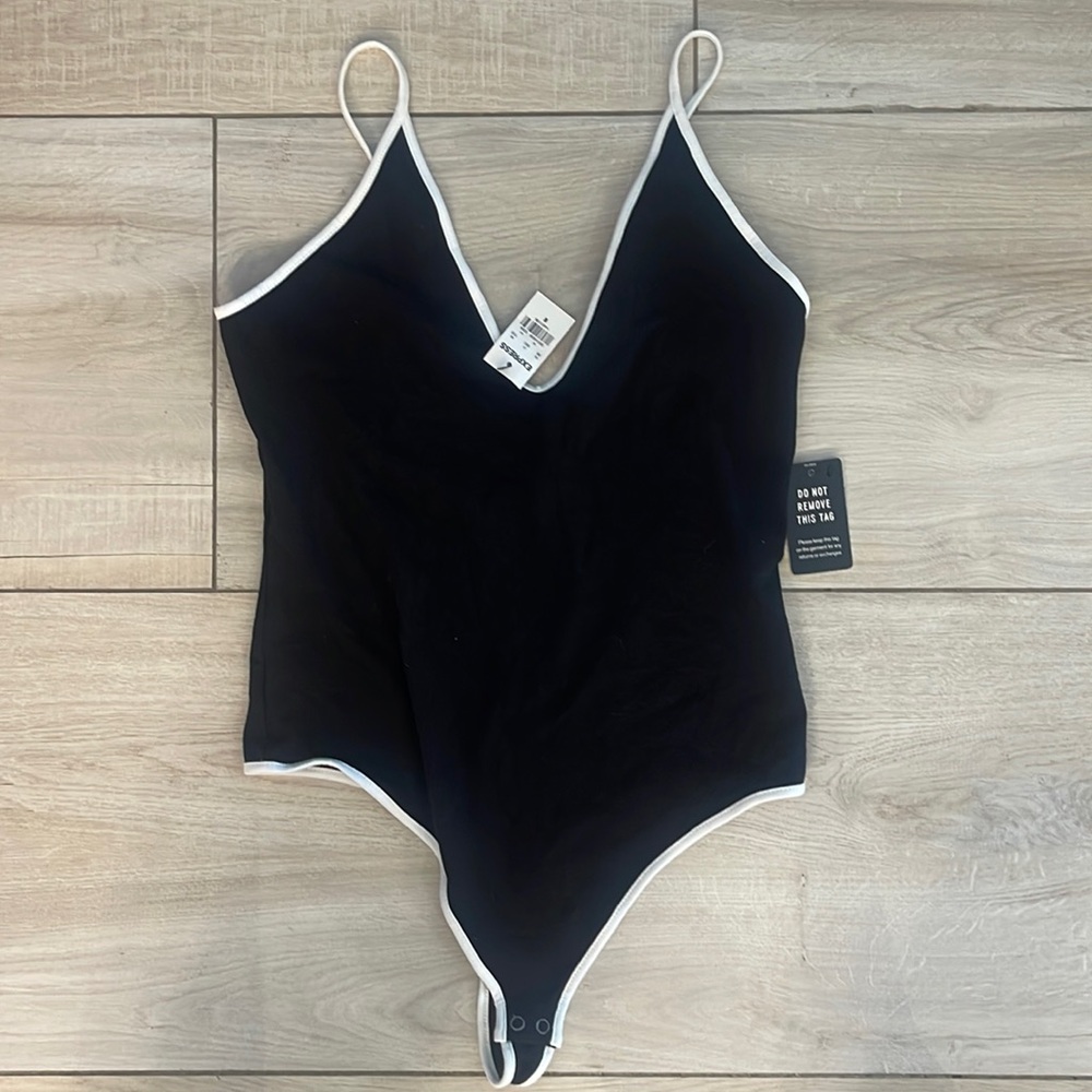 NWOT black and white low cut body suit, size medium